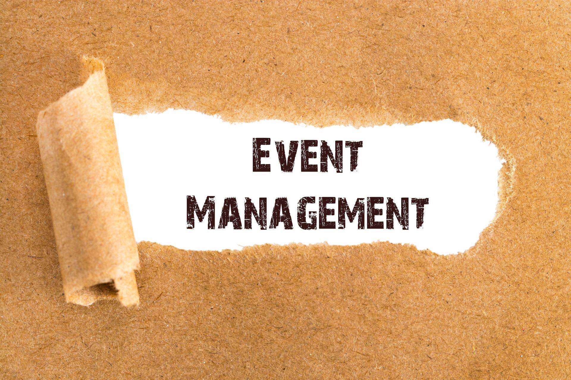 The text Event Management appearing behind torn brown paper.